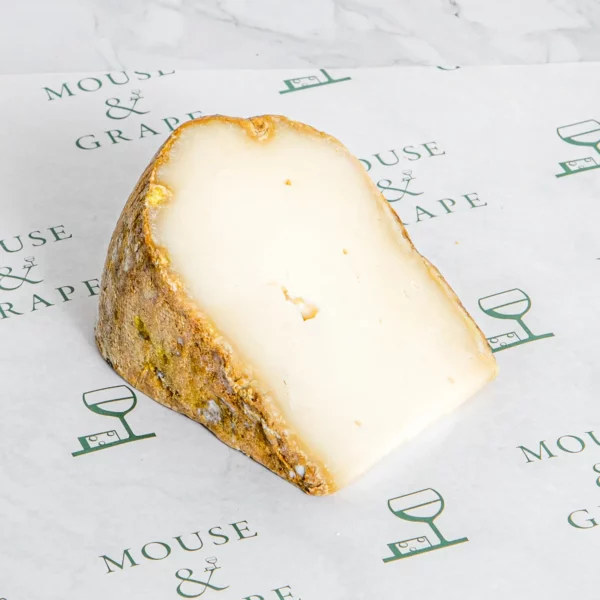A hard white cheese with a golden rind