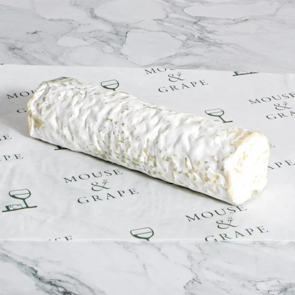A cylindrical shaped, soft, white cheese